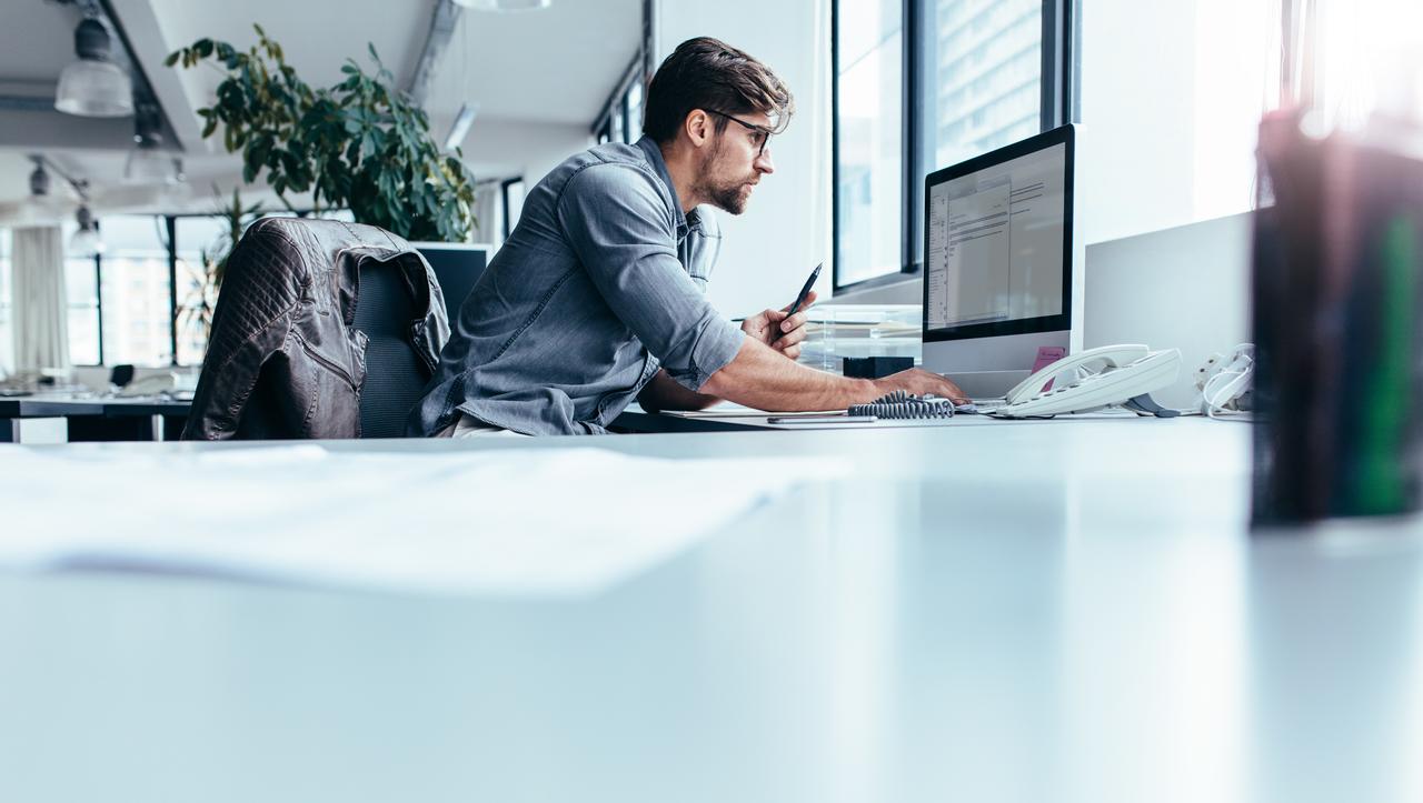 Businessman working on computer Businessman working on computer