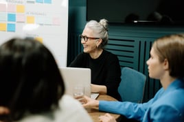 Business women discussing an event contract