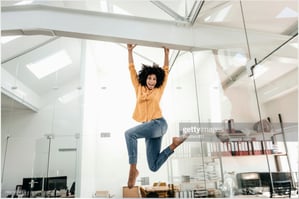 Girl jumping at the office